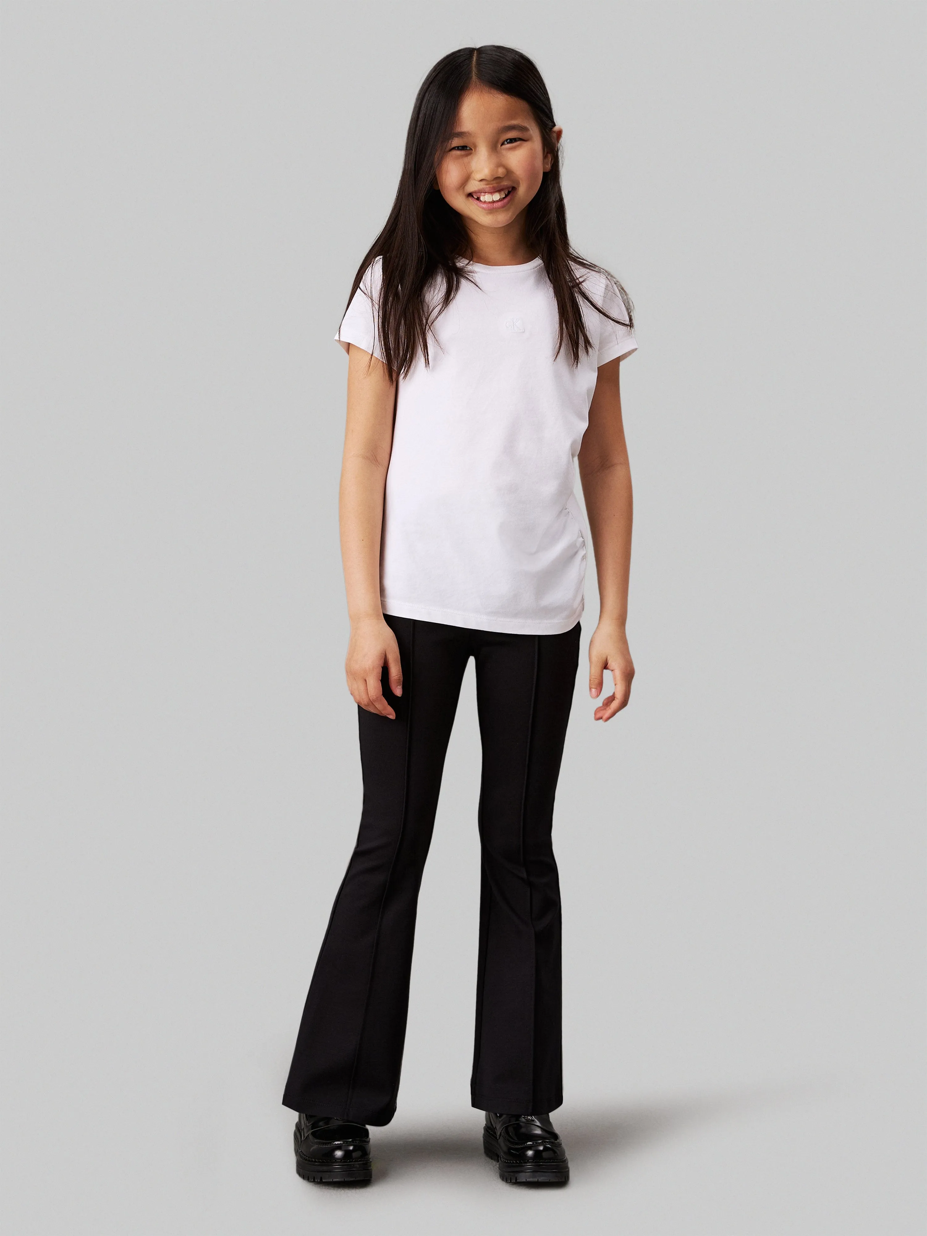 Calvin Klein Girls Punto Tape Flare Trousers in Black