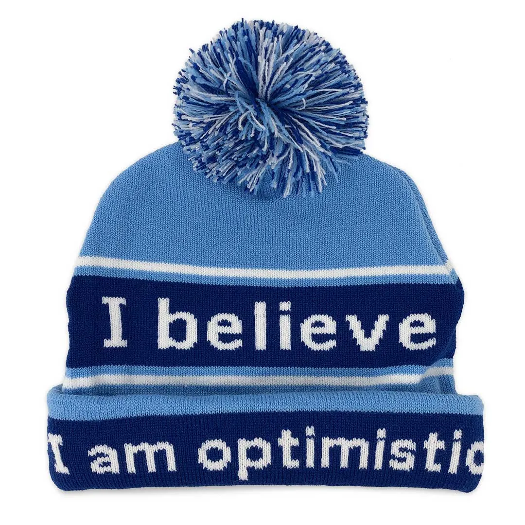 I believe™ blue knit beanie with I am optimistic™ on inside cuff