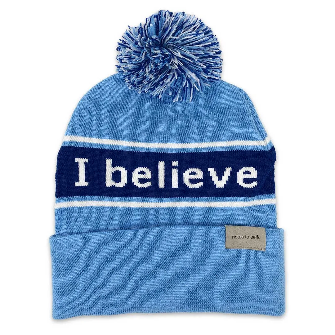 I believe™ blue knit beanie with I am optimistic™ on inside cuff