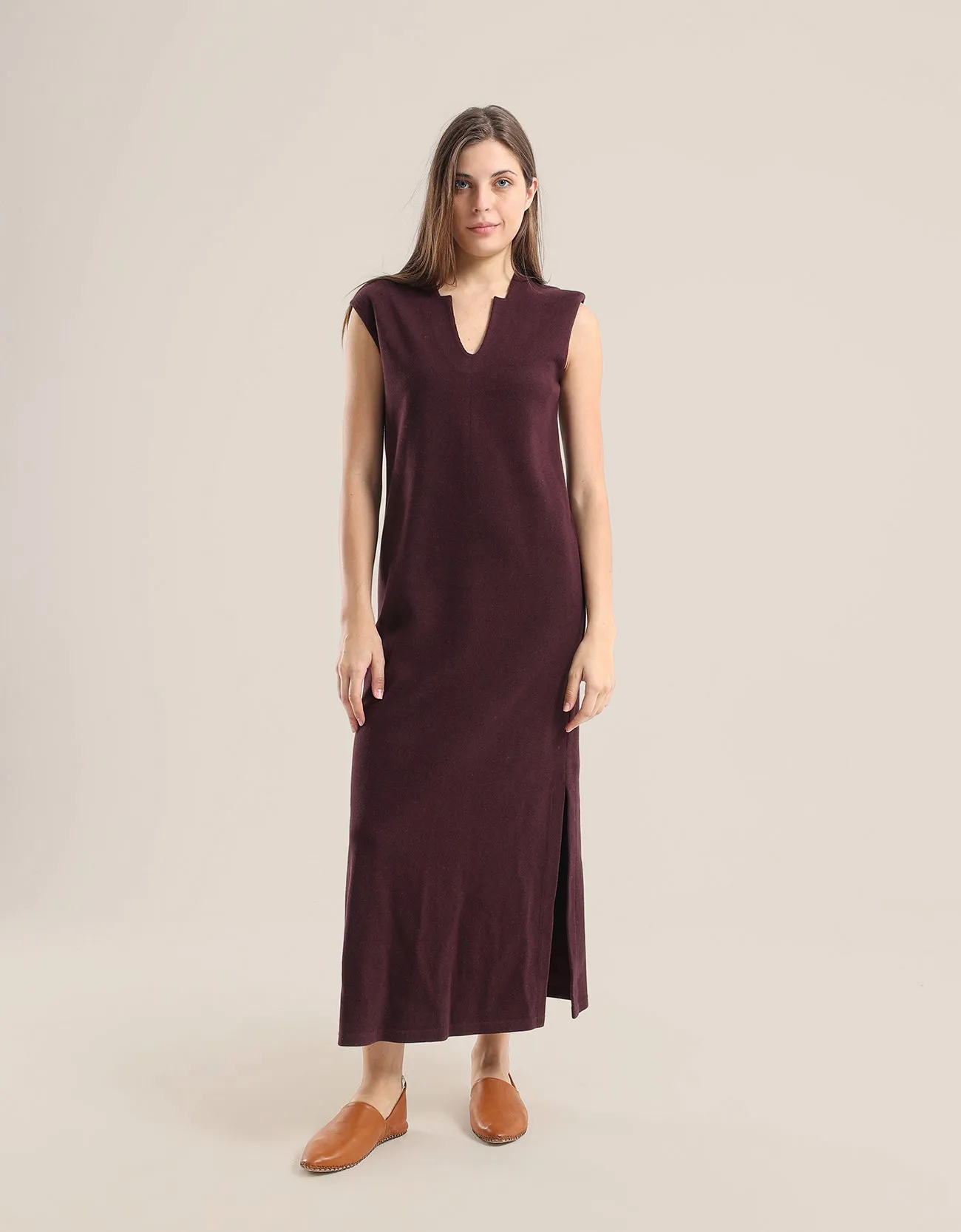 Sleeveless long dress with side slits