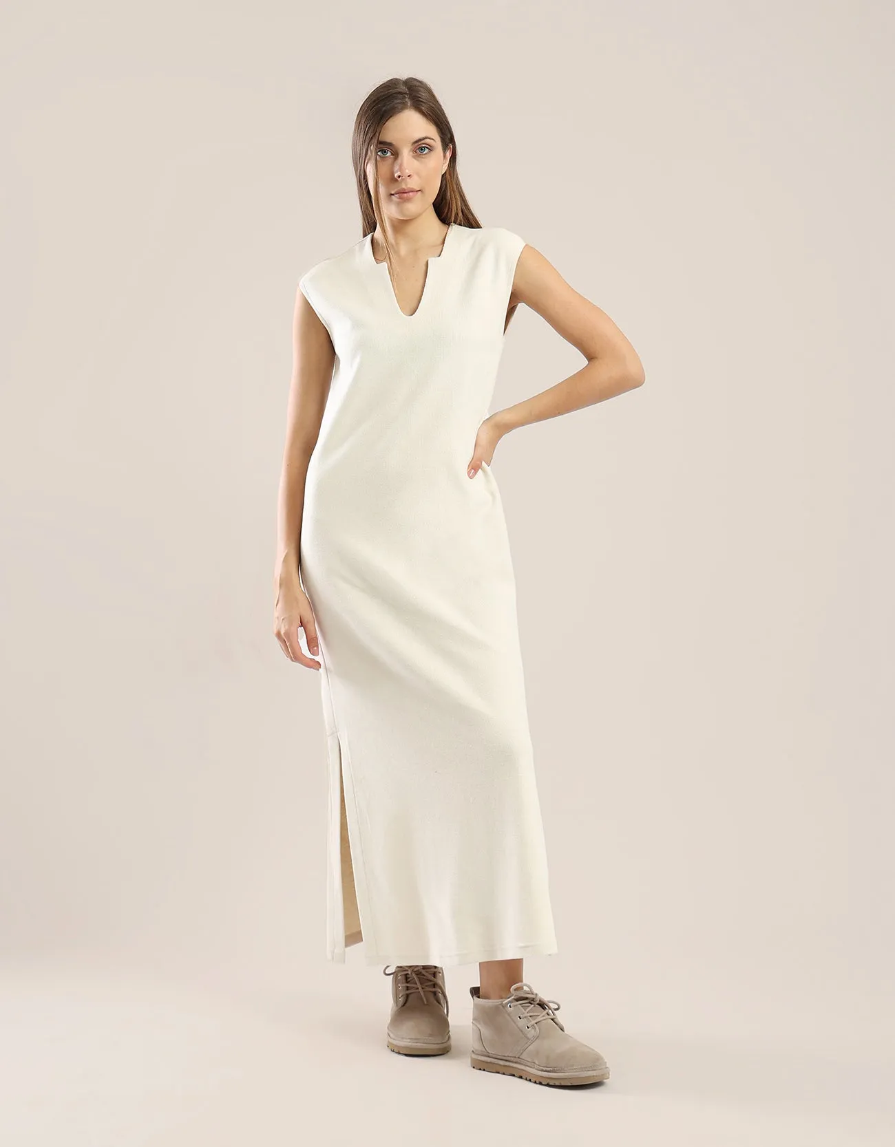 Sleeveless long dress with side slits